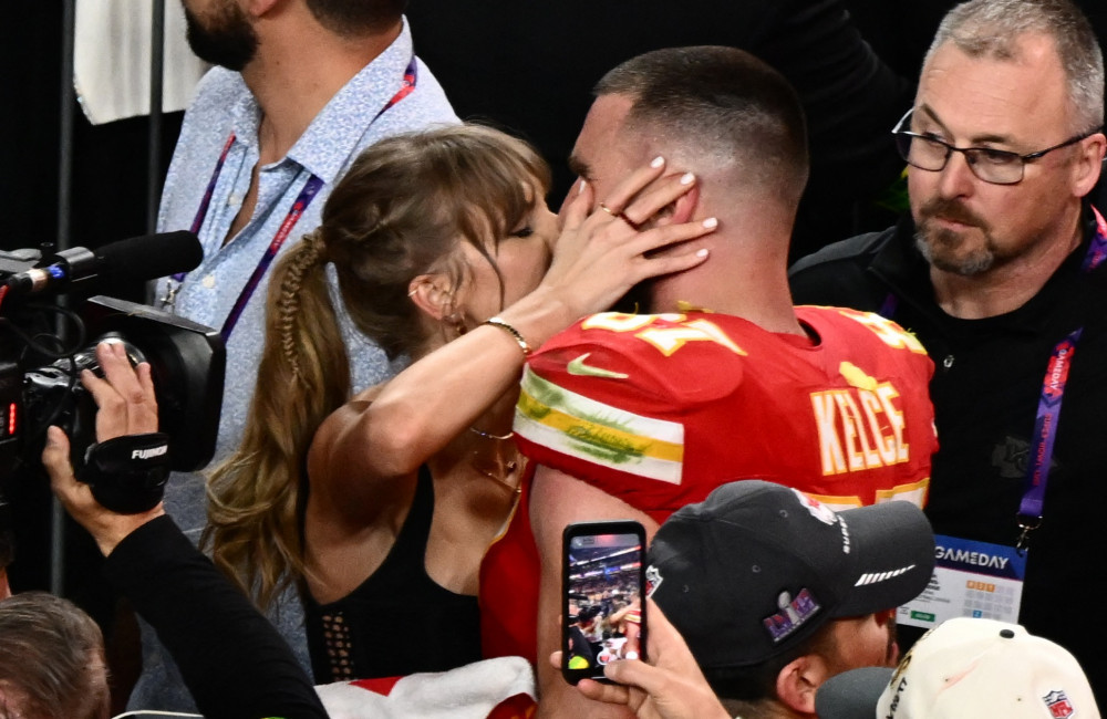 Taylor Swift and Travis Kelce kiss after Super Bowl win Feb 2024 Getty